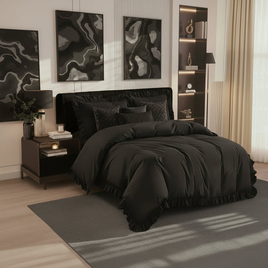 Modern bedroom with black bedding and abstract wall art