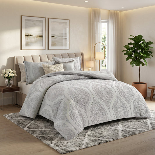 A four-piece premium embroidered bedding set displayed in a bedroom setting, including a duvet cover, quilt cover, and pillow covers, predominantly in black color with a floral pattern.
